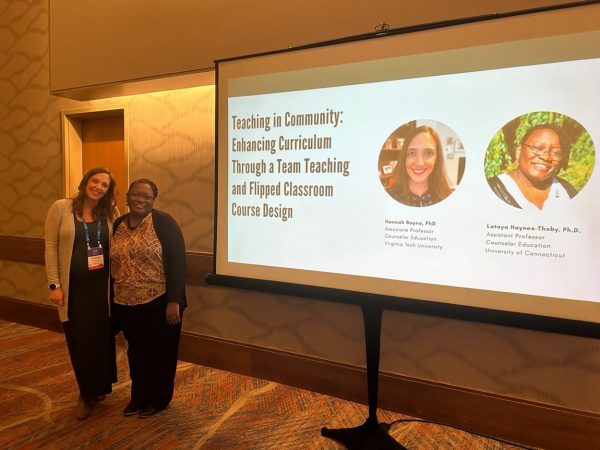 Two women present at a conference.