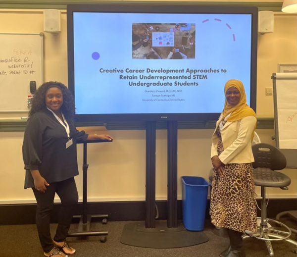 Two women present at a conference.